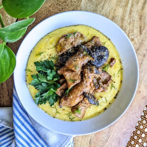 A bowl of creamy wild mushroom ragu on creamy Pecorino polenta.