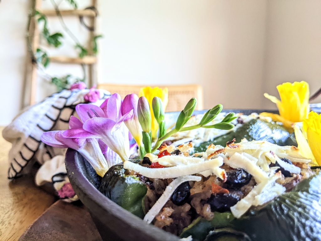 Fresh freesia and daffodils  give these stuffed poblanos a pop of pink and yellow.