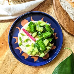 2 inch pieces of Persian Cucumbers served overtop a pillow of whipped honey feta. Served alongside pickled turnips and fresh mint and dill.