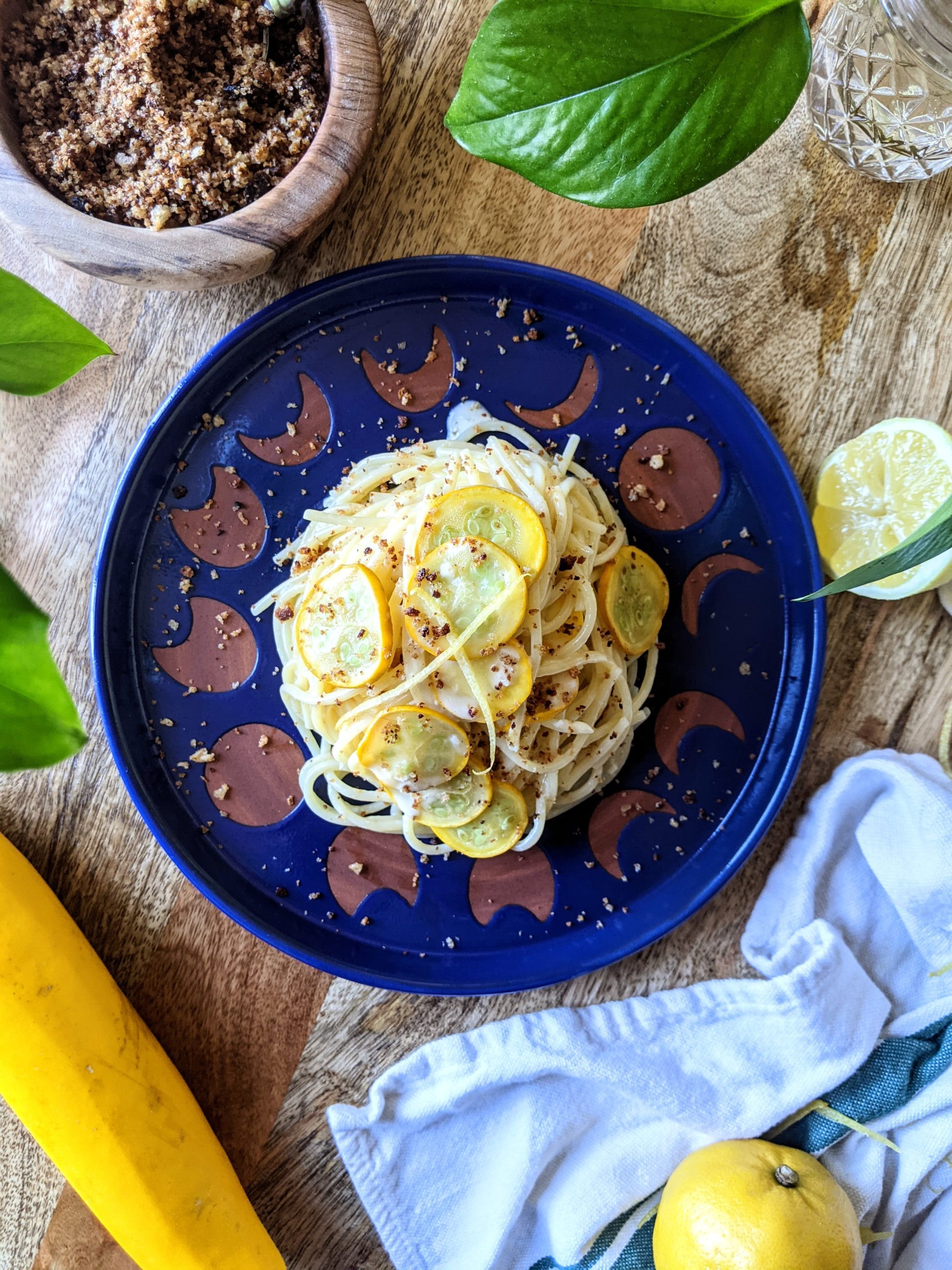 A nest of spaghetti tossed in a lemon cream sauce with thinly sliced zucchini rounds throughout. Served with homemade habanero breadcrumbs and lemon wedges.