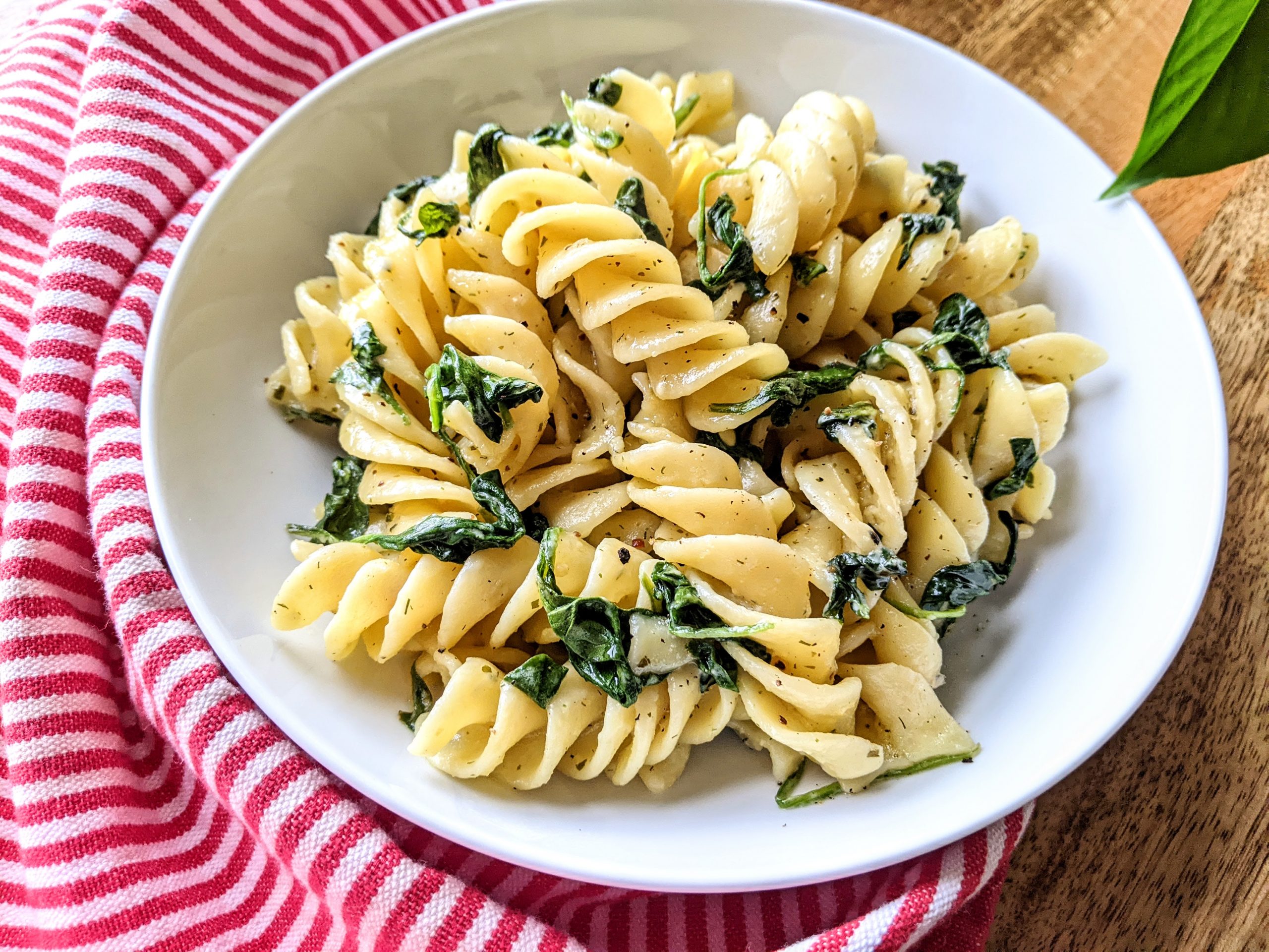 Close-up of a bowl of Boursin past with spinach.