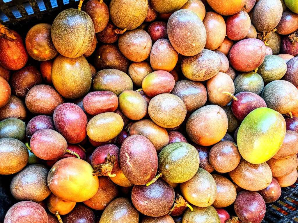 A basket of passion fruits at the Ferry Building Farmers Market in San Francisco.
