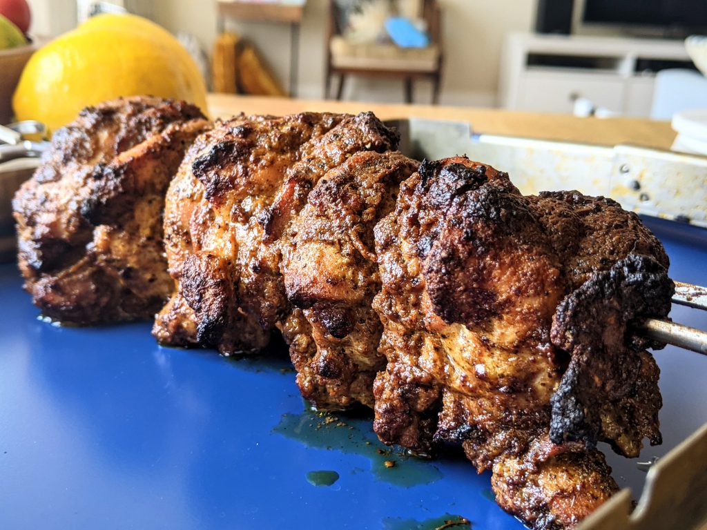 Chicken shawarma meat fresh out of the oven and resting before slicing.