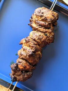 Chicken thighs folded onto kebab skewers create a faux rotisserie.