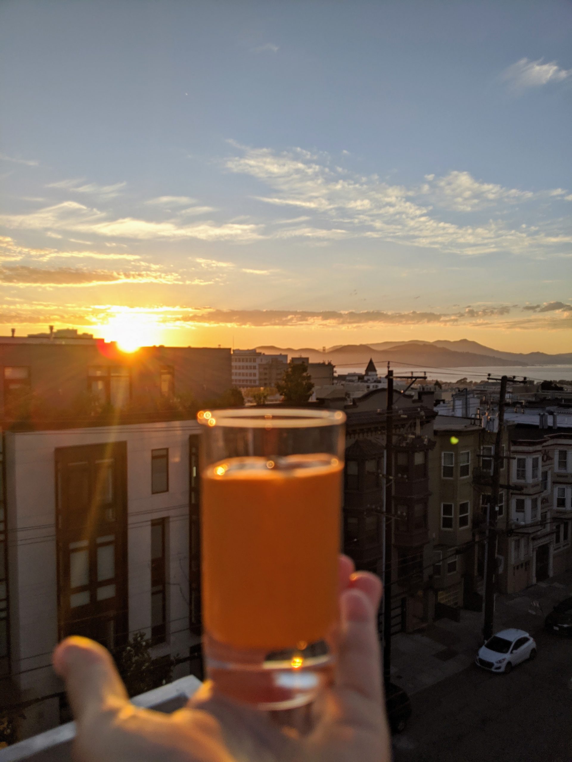 A shot glass of Andalusian Gazpacho with a backdrop of the Golden Gate Bridge.