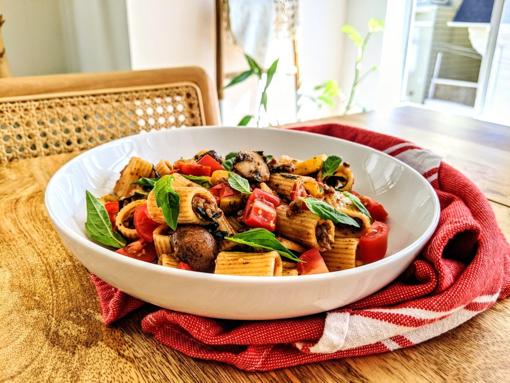 A bowl of Sausage Zucchini and Mushroom Pasta.