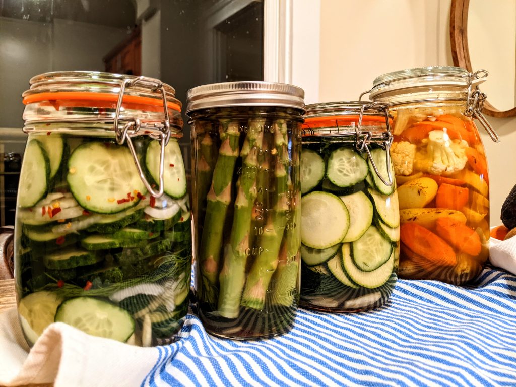 4 jars of fresh fridge pickles; cucumbers, asparagus, zucchini, and curried carrot and cauliflower.