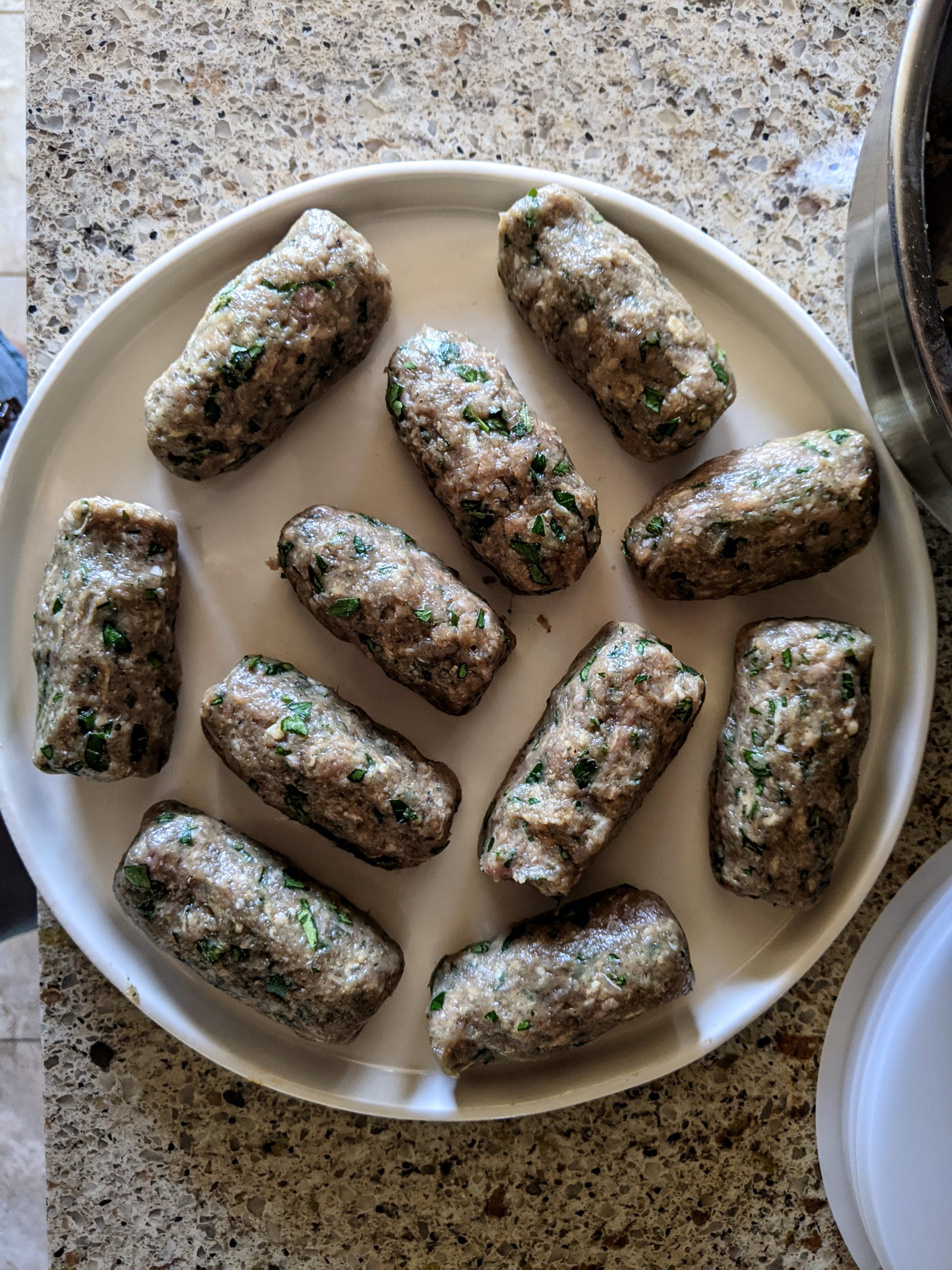 A plate of freshly rolled out Albanian Qoftes.
