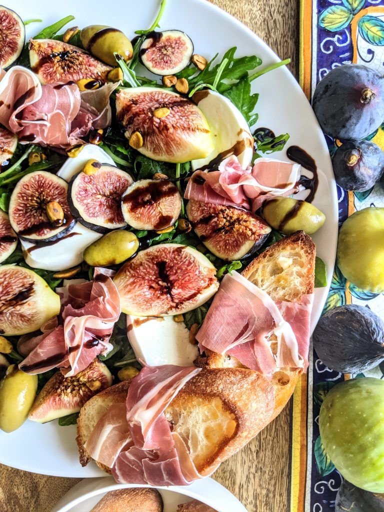 Fig Prosciutto and Mozzarella Salad with chili extra-virgin olive oil toasts.